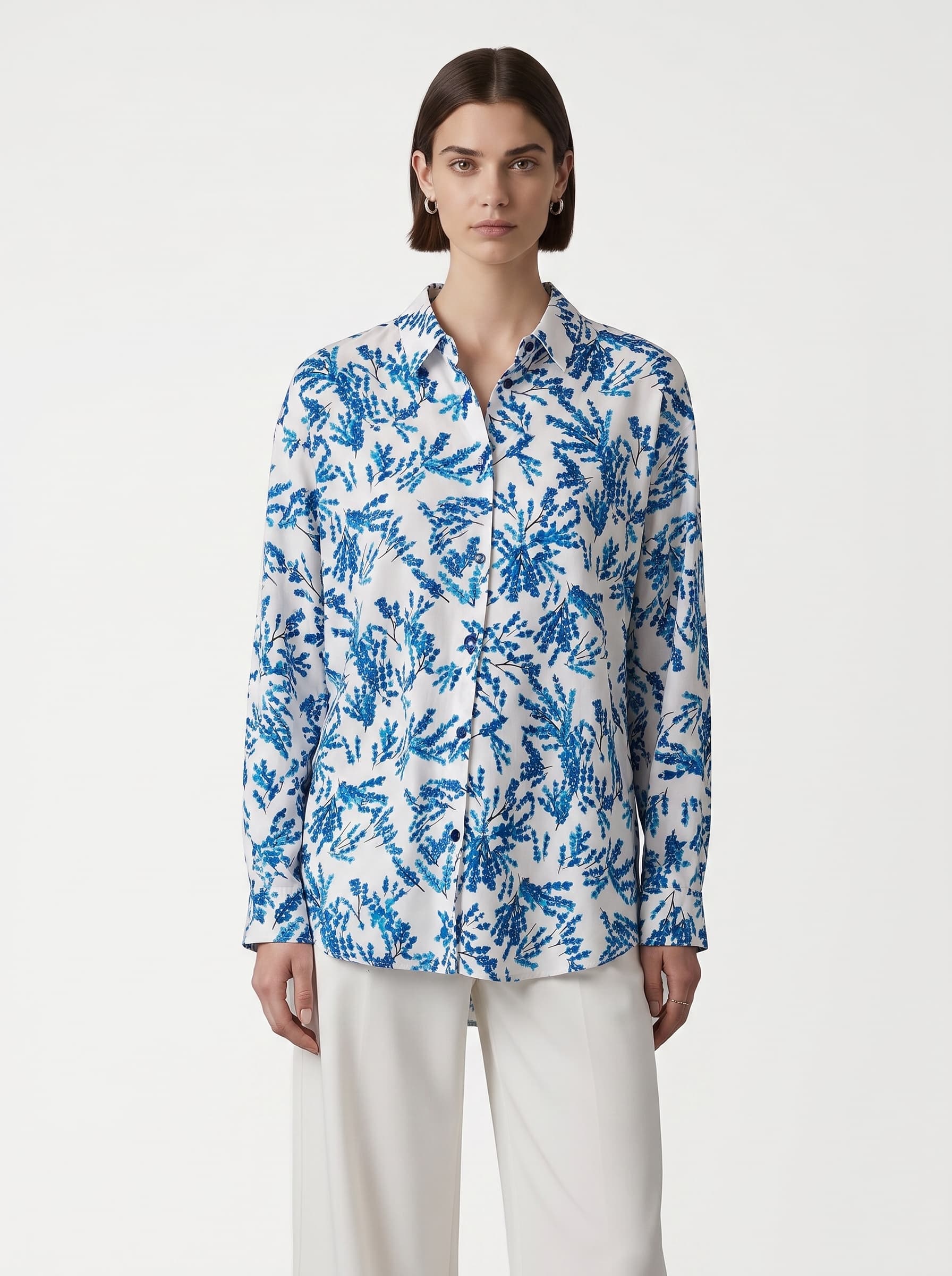 White shirt with a blue botanical print
